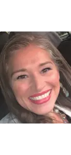 Natalie Davis, owner of Davis Pools, inspecting a custom pool project in Austin